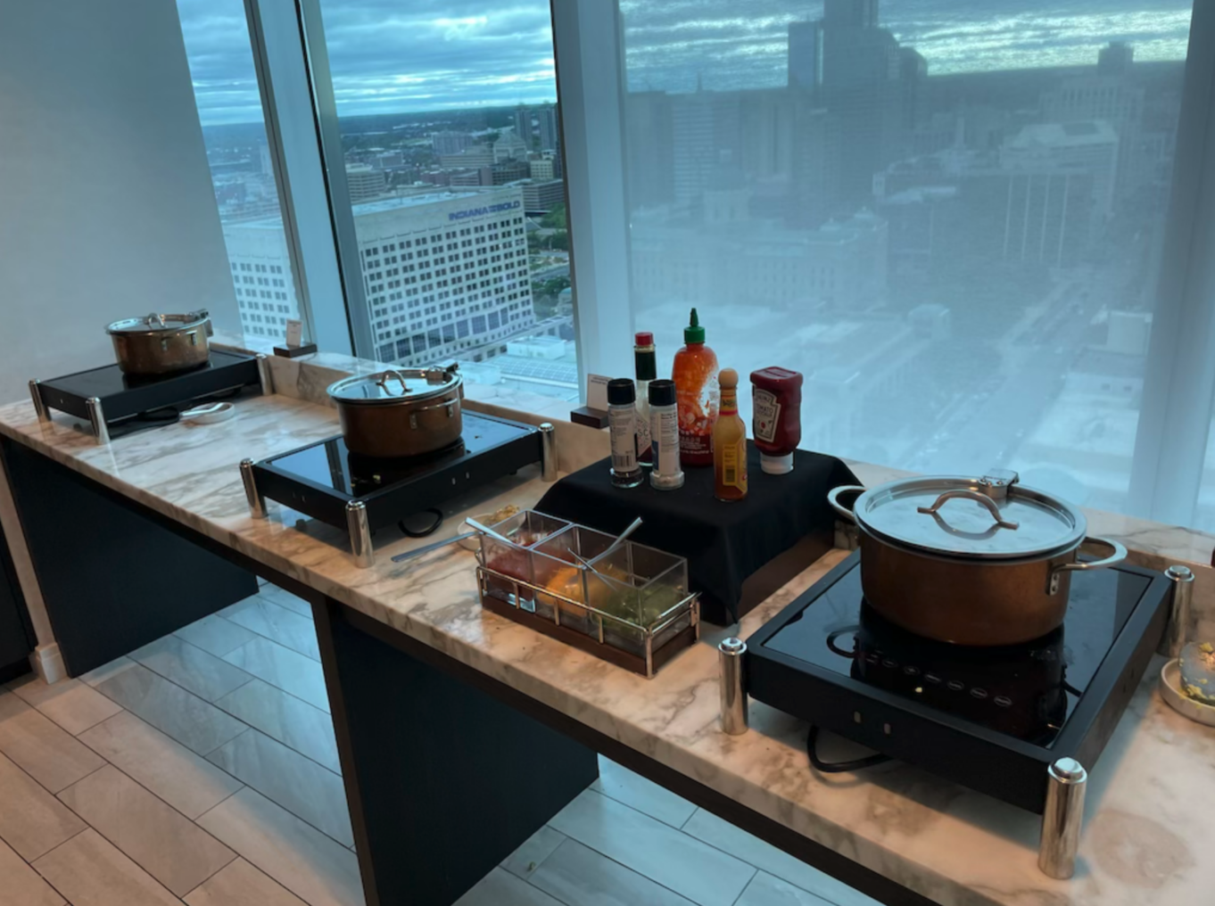 a kitchen with a counter top and a window with a view of a city